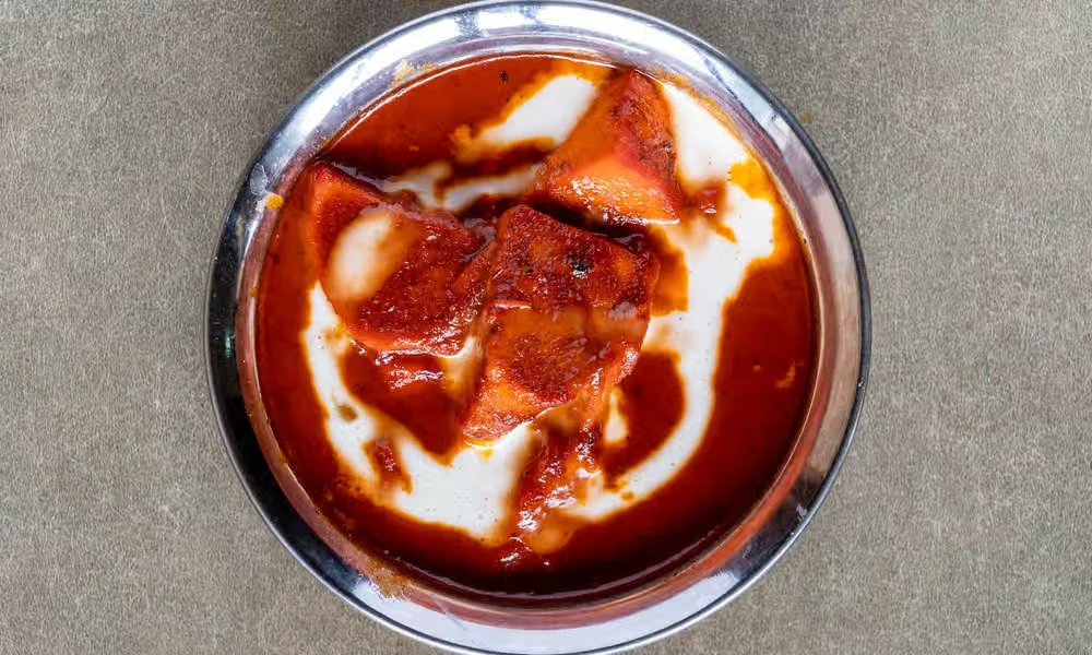Butter Chicken &mdash; oven-roasted chicken in a creamy tomato-butter gravy at Haandi Indian Cuisine in Bowness, Calgary