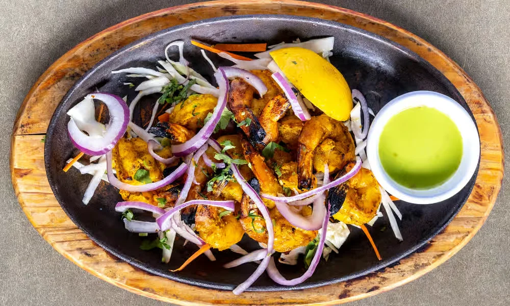 Tandoori Prawns &mdash; clay-oven grilled prawns with red onion, lemon and mint sauce at Haandi Indian Cuisine in Bowness, Calgary